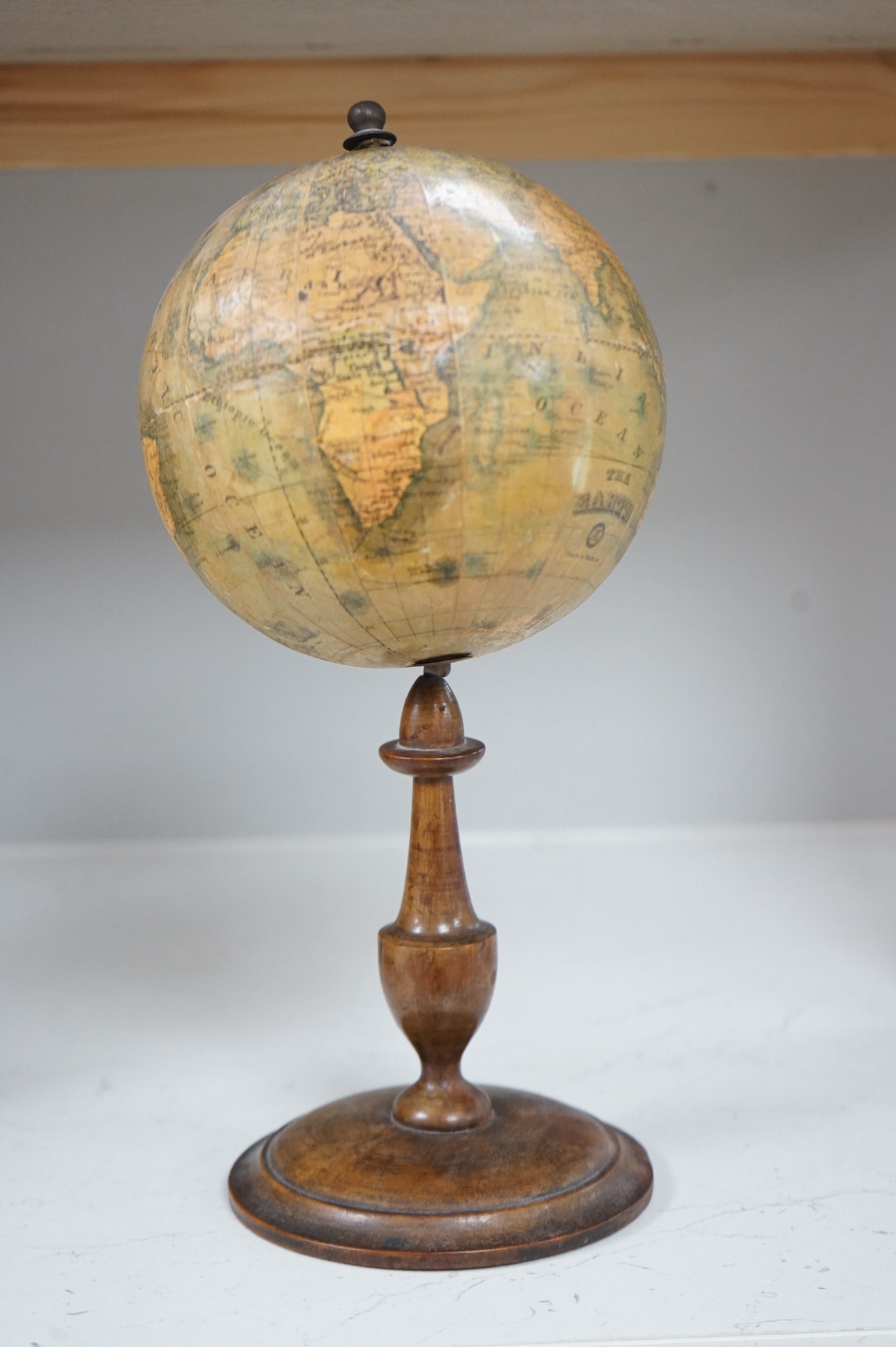 A 19th century Abel Klinger Bavarian revolving globe, 33 cm high. Condition - fair